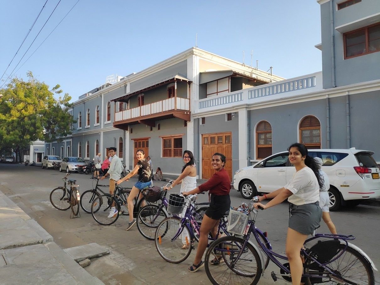 A heritage cycle tour group riding through White Town, Pondicherry