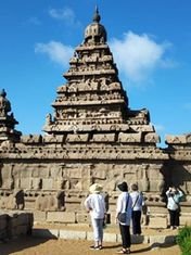 Ancient Pallava rock-cut monuments at Mahabalipuram under a clear sky