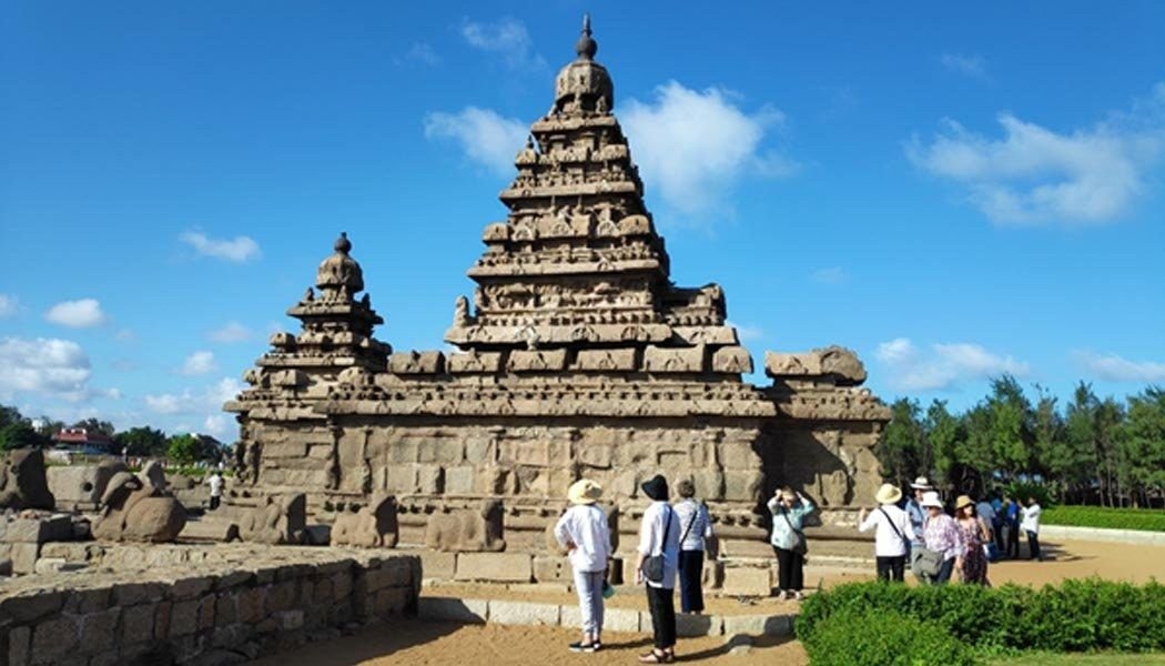 Ancient Pallava rock-cut monuments at Mahabalipuram under a clear sky