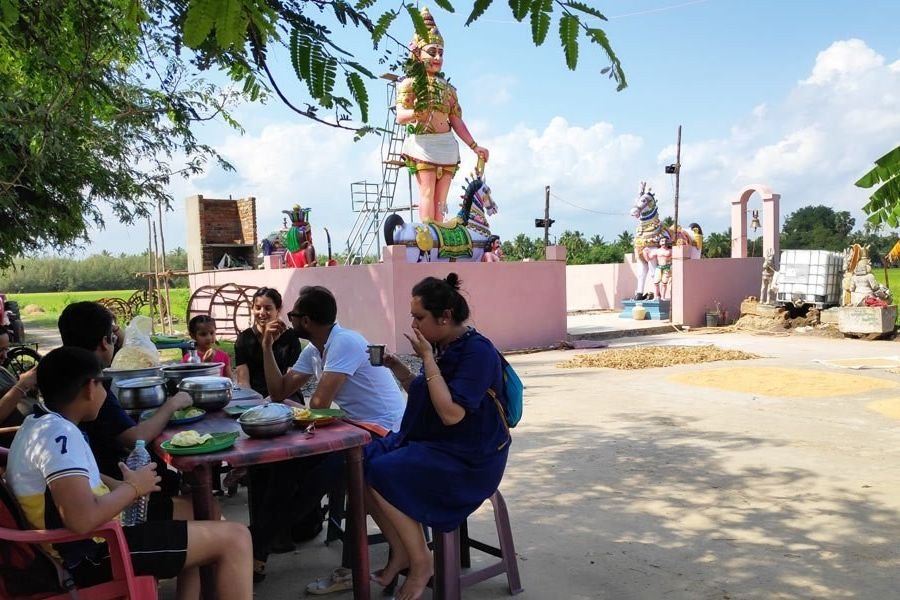 Outdoor farm-side lunch served in the village countryside near Pondicherry
