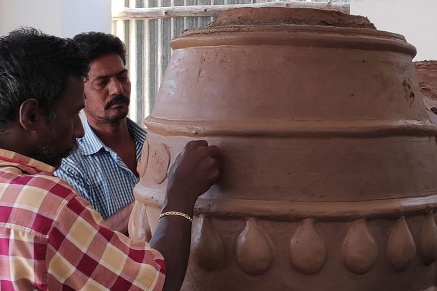Handmade terracotta figurines drying in a Pondicherry artisan workshop