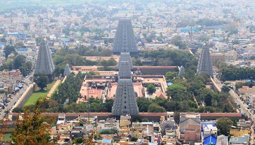 Temple towers of Tiruvannamalai with the Arunachala hill in the background