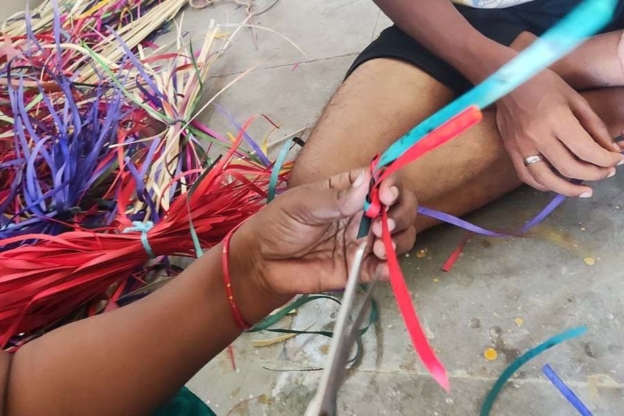A craftswoman weaving natural fibres by hand near Pondicherry